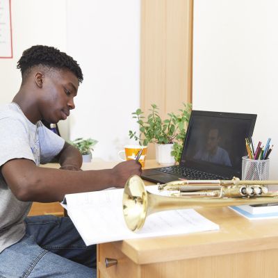 A boy sat at a desk